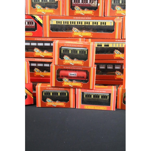 130 - 41 Boxed Hornby OO gauge items of rolling stock to include coaches, vans and wagons featuring R413 O... 