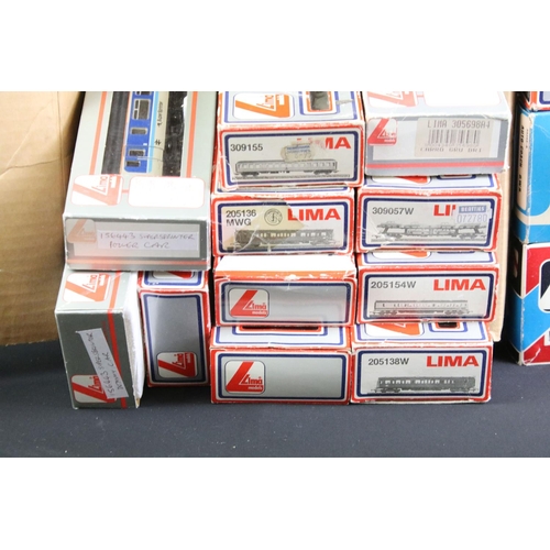 133 - 18 Boxed Lima OO gauge items of rolling stock to include coaches, car transporters and tankers, some... 