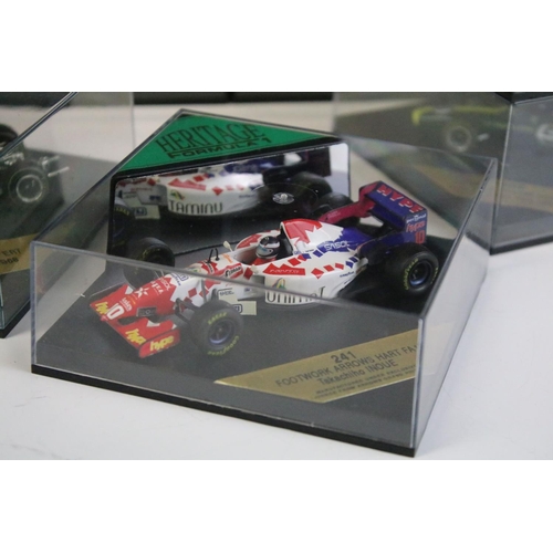 1025 - 20 Cased Heritage Formula 1 diecast model cars plus a Heritage Classics Damon Hill helmet, all varia... 