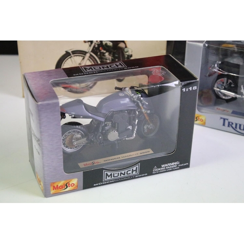 1067 - Seven boxed / cased diecast model motorbikes to include 2 x cased Nacoral models featuring Guzzi 750... 