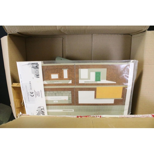 310 - Large quantity of trackside buildings and accessories to include plastic and card examples (numerous... 