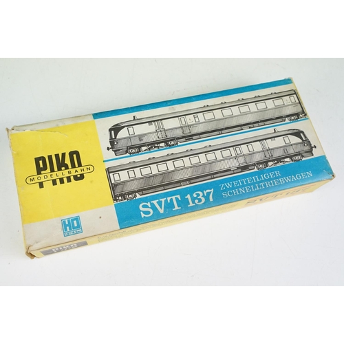 196 - Five boxed HO gauge locomotives and cars to include 3 x Piko (BR185 Verbrennungstriebwagen, E42 and ... 