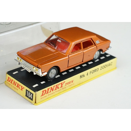 1225 - Seven boxed / cased Dinky diecast models to include 1415 Peugeot 504 in blue, 164 Mk4 Ford Zodiac in... 