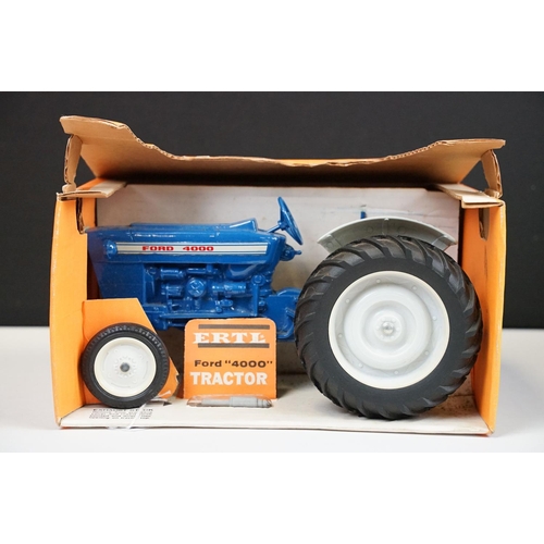 1199 - Boxed ERTL Ford 4000 Tractor diecast model in blue, complete with exhaust stack still sealed in pack... 