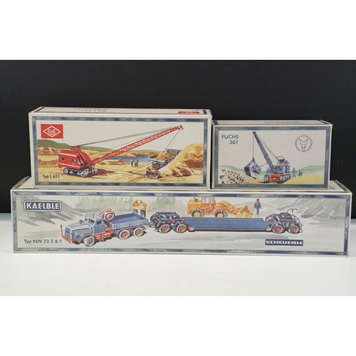 1179 - Three boxed 1/50 scale NZG construction diecast models to include O&K Typ L651 crane in red, Fuchs T... 