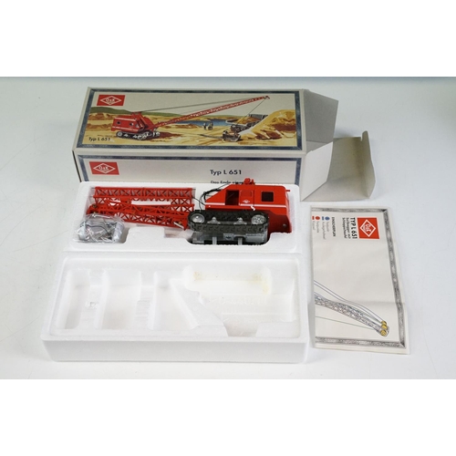 1179 - Three boxed 1/50 scale NZG construction diecast models to include O&K Typ L651 crane in red, Fuchs T... 