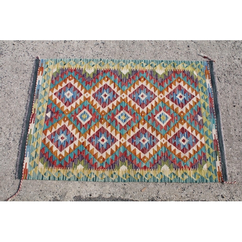 784 - Hand knotted woollen Chobi Kilim rug, 150cm long x 100cm wide