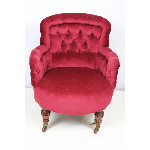 650 - Edwardian tub shaped armchair, with upholstered button back, on turned tapering legs and castors, on... 