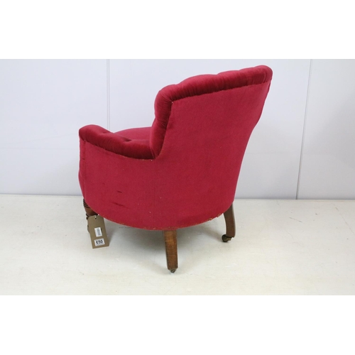 650 - Edwardian tub shaped armchair, with upholstered button back, on turned tapering legs and castors, on... 