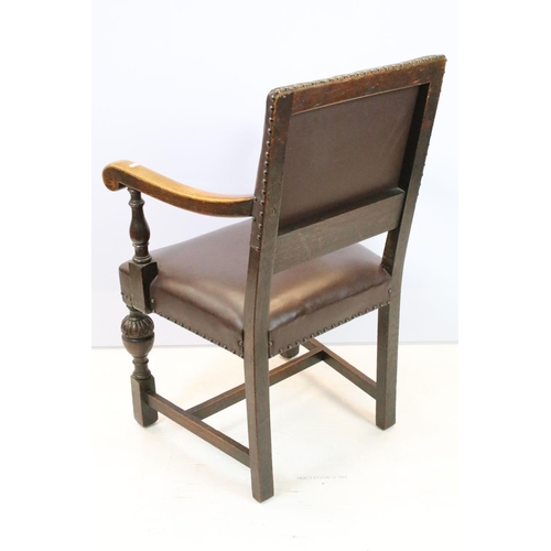 652 - Set of six carved oak dining chairs, including two chairs with arms, upholstered in studded brown le... 