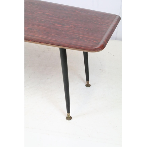 742 - Mid century coffee table, with red and black top, on black tapering legs and metal feet, 40cm high x... 