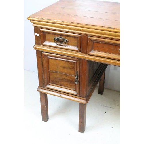 747 - Early 20th century kneehole desk with an arrangement of three drawers above two cupboard drawers wit... 