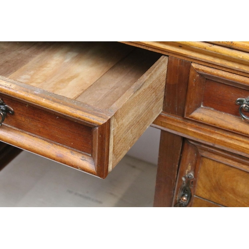 747 - Early 20th century kneehole desk with an arrangement of three drawers above two cupboard drawers wit... 