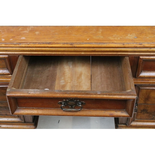 747 - Early 20th century kneehole desk with an arrangement of three drawers above two cupboard drawers wit... 