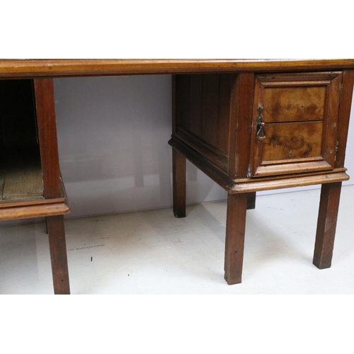 747 - Early 20th century kneehole desk with an arrangement of three drawers above two cupboard drawers wit... 