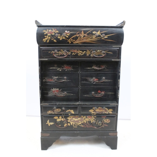 748 - Oriental lacquered cabinet, the japanned surface painted with flowers and branches, with an arrangem... 