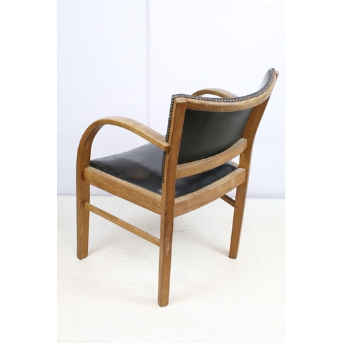 663 - Mid century chair with curved open arms, the back with studded black leatherette panel and black lea... 