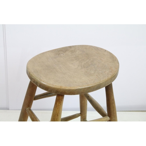 666 - 19th century tall stool with oval one piece elm seat, 60cm high x 43cm wide