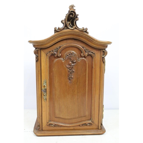 677 - Early 20th century Continental ornately carved small cabinet with single door, shelf to interior, wi... 