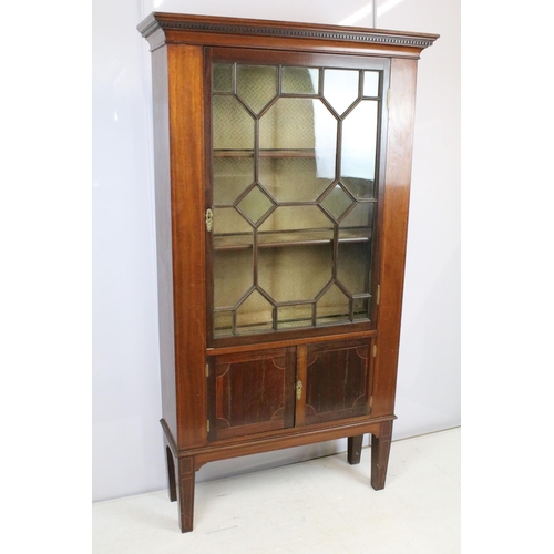 678 - Early 20th century mahogany inlaid display cabinet, with dentil moulded cornice above an astragal gl... 