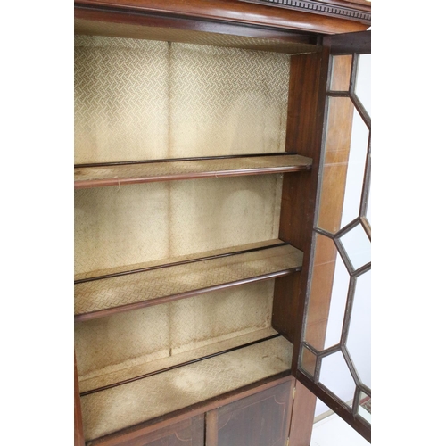 678 - Early 20th century mahogany inlaid display cabinet, with dentil moulded cornice above an astragal gl... 