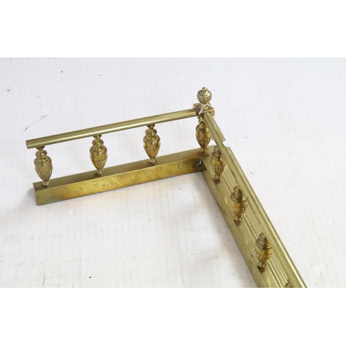 680 - Early 20th century brass fire fender, with fluted baluster shape galleried design, 18cm high x 106.5... 