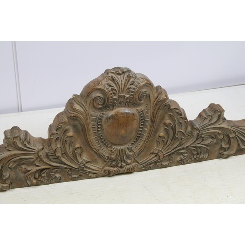 704 - Decorative wood effect hanging panel, with scrolling leaf decoration, 35cm high x 112.5cm wide