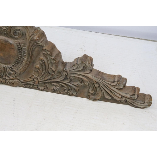 704 - Decorative wood effect hanging panel, with scrolling leaf decoration, 35cm high x 112.5cm wide