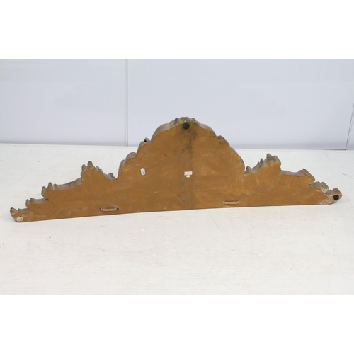 704 - Decorative wood effect hanging panel, with scrolling leaf decoration, 35cm high x 112.5cm wide