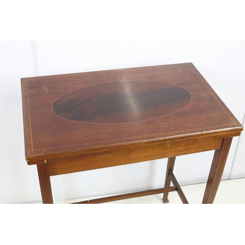 714 - Edwardian mahogany inlaid folding green baize lined card table, the top with oval panel, with stretc... 