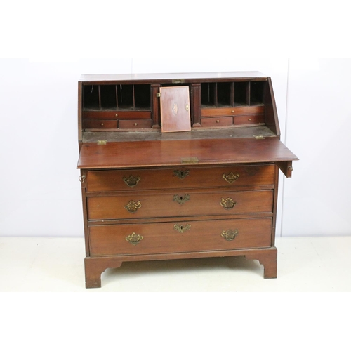 722 - George III mahogany bureau, the fall front opening to reveal an arrangement of cubby holes and drawe... 