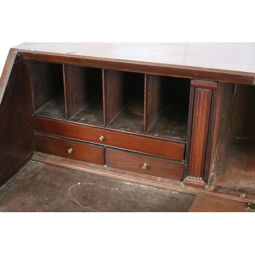 722 - George III mahogany bureau, the fall front opening to reveal an arrangement of cubby holes and drawe... 