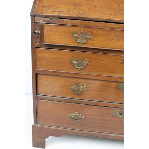 722 - George III mahogany bureau, the fall front opening to reveal an arrangement of cubby holes and drawe... 