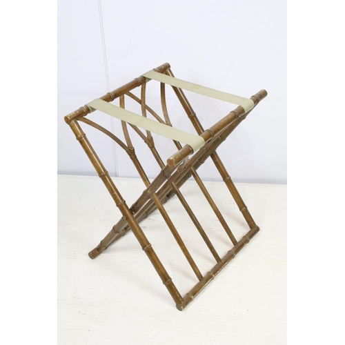 725 - Folding luggage stand, the wooden supports turned to resemble bamboo, with cane work, 57cm high x 41... 