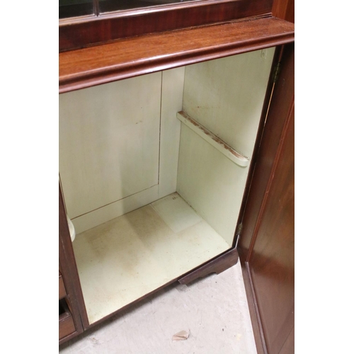 729 - Early 20th century mahogany breakfront bookcase, the upper section with dentil moulding above astrag... 