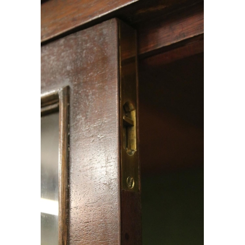 729 - Early 20th century mahogany breakfront bookcase, the upper section with dentil moulding above astrag... 