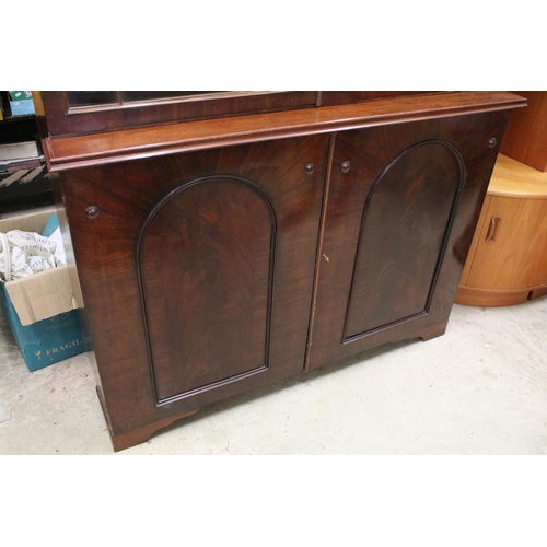 729 - Early 20th century mahogany breakfront bookcase, the upper section with dentil moulding above astrag... 