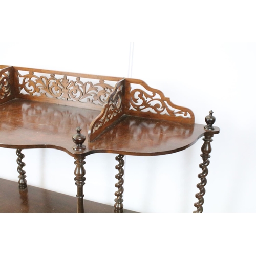 761 - Early 20th century rosewood carved three tier shelf, with raised fretwork galleried back above spira... 