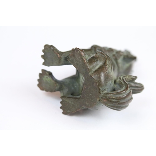 290 - A Chinese bronze ornamental seated foo dog.