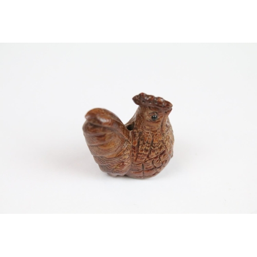 294 - Three Chinese carved wooden netsuke in the form of a Monkey, dog and cockerel.