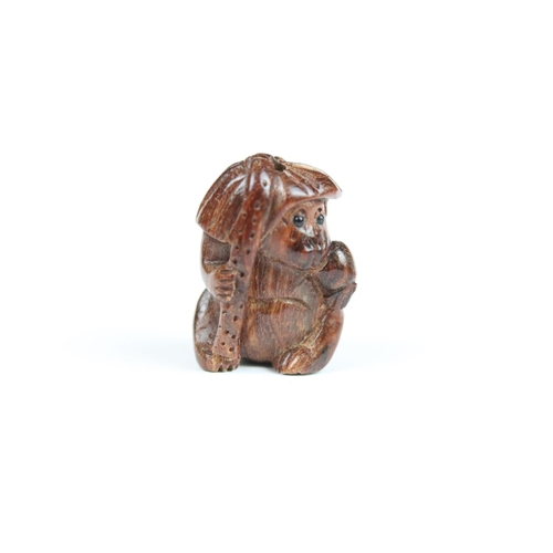 294 - Three Chinese carved wooden netsuke in the form of a Monkey, dog and cockerel.