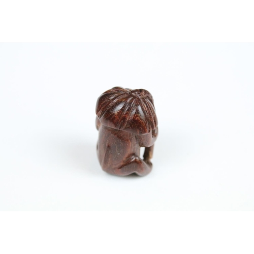 294 - Three Chinese carved wooden netsuke in the form of a Monkey, dog and cockerel.