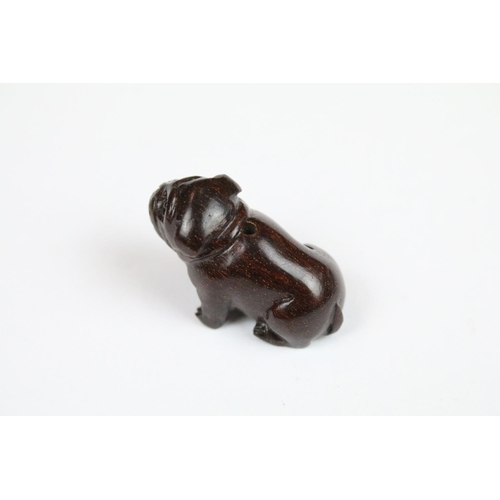 294 - Three Chinese carved wooden netsuke in the form of a Monkey, dog and cockerel.