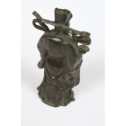 298 - A Chinese bronze figure in the traditional style, stands approx 9.5cm in height.