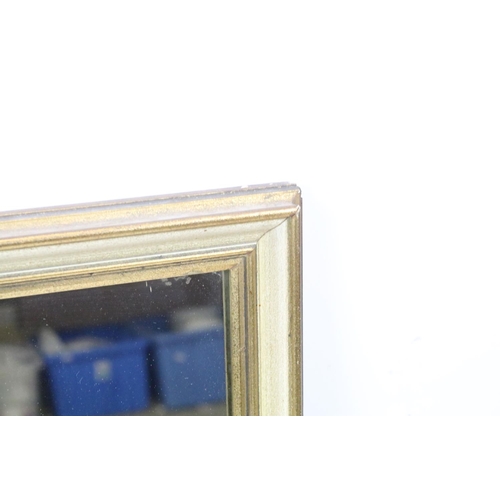 734 - Gilt framed rectangular mirror, label verso for Ernest Muddiman, Buckingham Palace Road, London, SW1... 