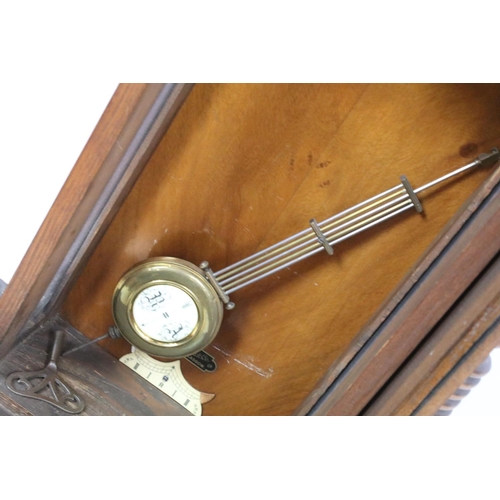 737 - Chas L Reis, Glasgow, carved mahogany and oak wall clock, with maker's plaque, 100cm high