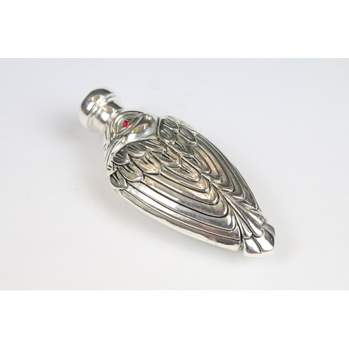 313 - Perfume bottle in the art deco style set with ruby bird eyes