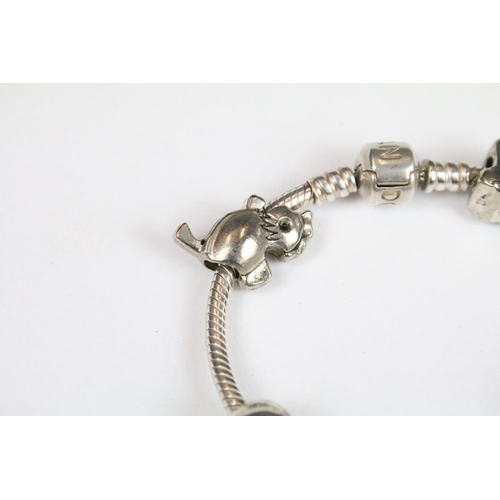 314 - A boxed Pandora charm bracelet with charms together with a ladies Accurist watch.