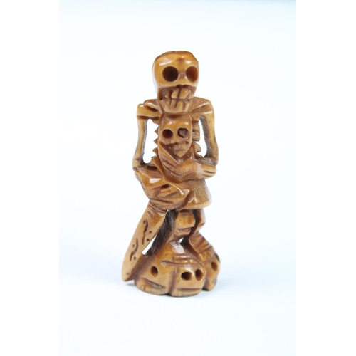 316 - Two carved Netsuke in the the form of skeletal figures.