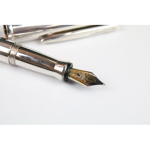 331 - A white metal Waterford fountain pen with 18ct gold nib within Waterman leather case.